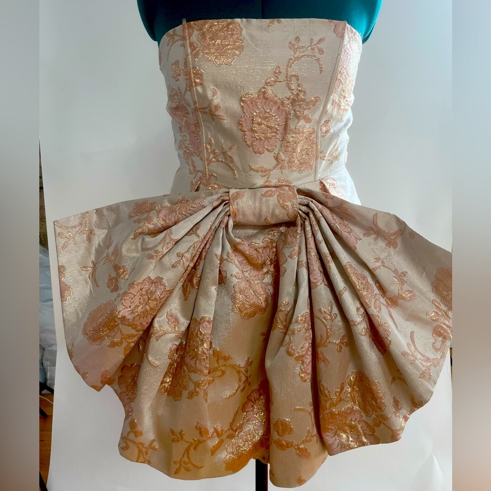 Vintage-inspired strapless one piece dress by Akira.